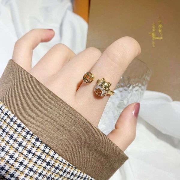 diamond inlaid cat opening female sand gold jewelry transport hollow copper coin index finger ring temperament, Black
diamond inlaid cat opening female sand gold jewelry transport hollow copper coin index finger ring temperament, Black