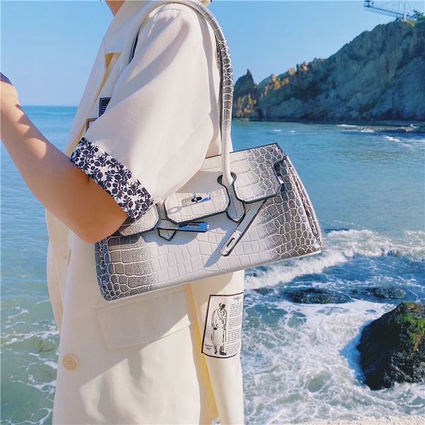 crocodile goddess bag