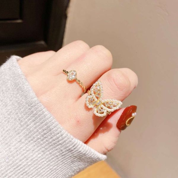 korean fashion butterfly zircon adjustable gold plated pearl hollow ring for women's hands, Black
korean fashion butterfly zircon adjustable gold plated pearl hollow ring for women's hands, Black