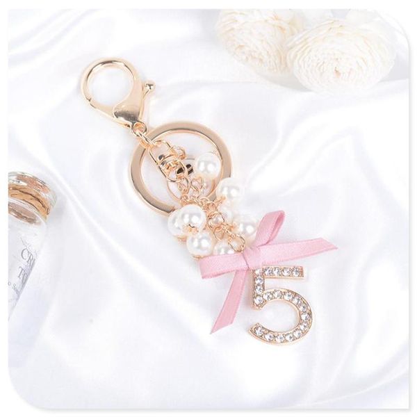 keychains digital 5 pendant pearl bow car key chain beauty head small gift fashion exquisite, Silver
keychains digital 5 pendant pearl bow car key chain beauty head small gift fashion exquisite, Silver