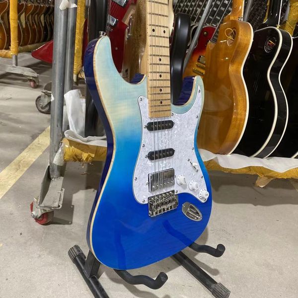 custom tom anderson electric guitar flamed tiger striped maple with white pearl pickguard
custom tom anderson electric guitar flamed tiger striped maple with white pearl pickguard