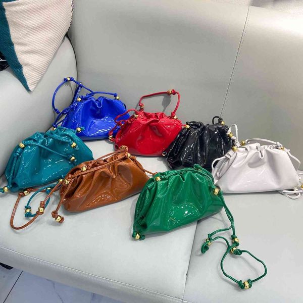 2021 autumn and winter small golden ball menger bag bright lacquer leather round beads chain cloud fold armpit dumpling
2021 autumn and winter small golden ball menger bag bright lacquer leather round beads chain cloud fold armpit dumpling