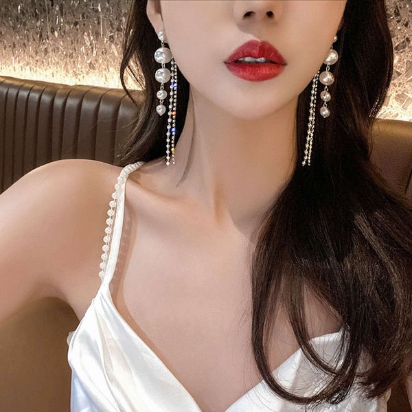 sparkle diamond long pearl tassel autumn and winter korean temperament net red fashion advanced sense earrings, Black
sparkle diamond long pearl tassel autumn and winter korean temperament net red fashion advanced sense earrings, Black