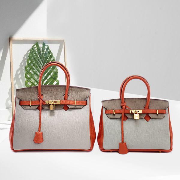 2021 new real litchi pattern women's color matching head, one shoulder leather handbag, fashion bag trend
2021 new real litchi pattern women's color matching head, one shoulder leather handbag, fashion bag trend