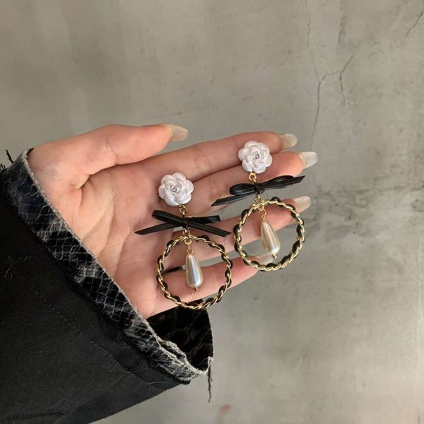 925 silver needle korean bowknot pearl camellia long earrings and earrings
925 silver needle korean bowknot pearl camellia long earrings and earrings