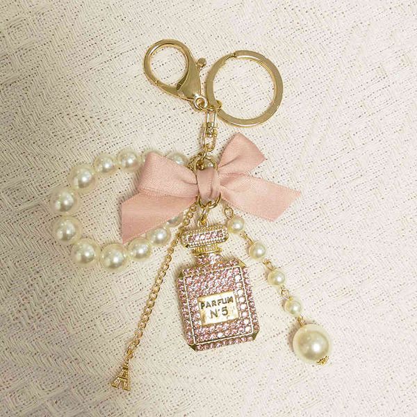 trendy key chain number 5 bottle keychain for woman luxury jewelry bow car keyring camellia pearl pendant keychains bag decoration, Slivery;golden
trendy key chain number 5 bottle keychain for woman luxury jewelry bow car keyring camellia pearl pendant keychains bag decoration, Slivery;golden