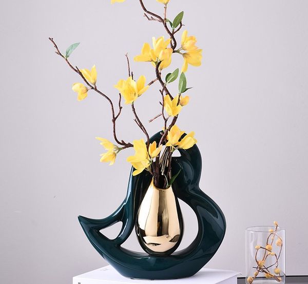 creative heart shaped ceramic vases golden drop shape flowers arrangement hollow porcelain vase flower insert modern home decor
creative heart shaped ceramic vases golden drop shape flowers arrangement hollow porcelain vase flower insert modern home decor