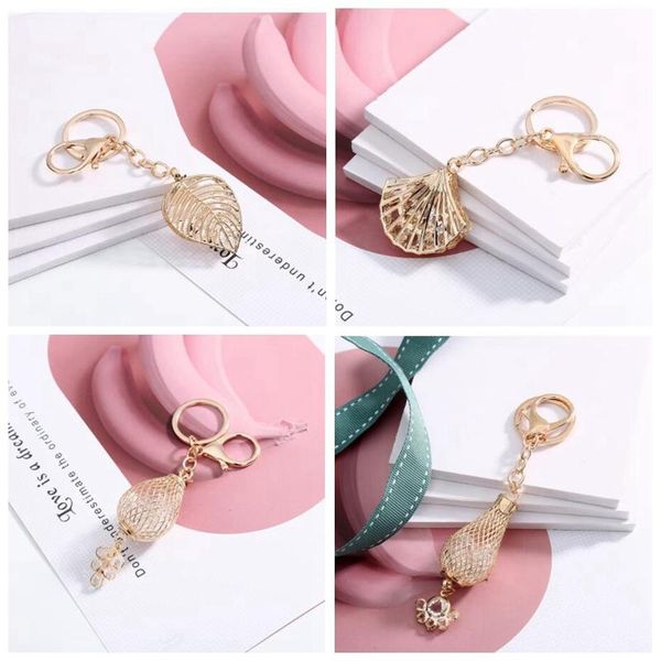 keychains 2021 fashion hollow leaves shape keychain gold color metal car key chain keyring charm bag pendant gift, Silver
keychains 2021 fashion hollow leaves shape keychain gold color metal car key chain keyring charm bag pendant gift, Silver