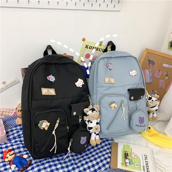 school bags fashion women's backpack cute doll solid color nylon waterproof schoolbag for girls large capacity with many pockets
school bags fashion women's backpack cute doll solid color nylon waterproof schoolbag for girls large capacity with many pockets
