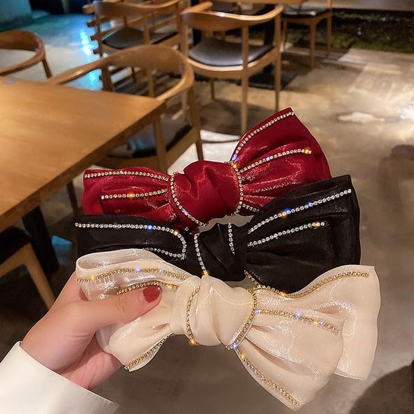 style with diamond skirt big bow silk cloth mercerized fabric clip spring hairpin hair accessories
style with diamond skirt big bow silk cloth mercerized fabric clip spring hairpin hair accessories