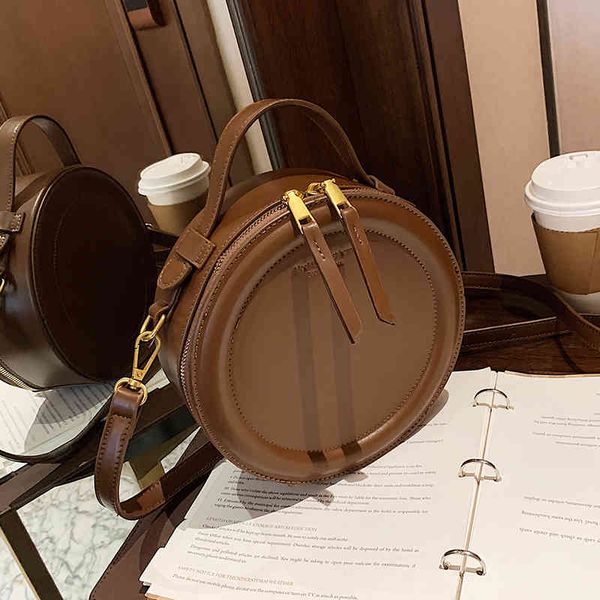 high sense of western style retro small round bag 2021new fashion women's designer autumn and winter messenger
high sense of western style retro small round bag 2021new fashion women's designer autumn and winter messenger
