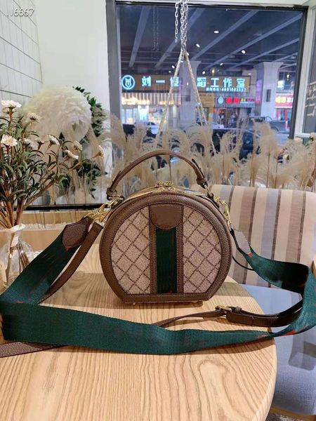 designer women's single shoulder half round cake bag, red and green strap gift box packaging
designer women's single shoulder half round cake bag, red and green strap gift box packaging