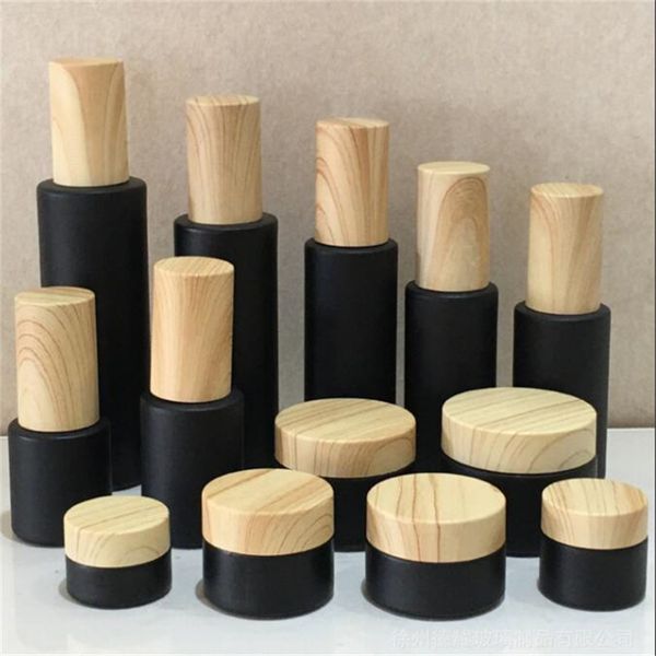 black frosted glass cosmetic bottle cream jars spray lotion bottles refillable container with wood grain plastic lids
black frosted glass cosmetic bottle cream jars spray lotion bottles refillable container with wood grain plastic lids