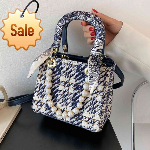2021 new ins super fire bag women's fashion color matching pearl chain handbag versatile messenger princess bag
2021 new ins super fire bag women's fashion color matching pearl chain handbag versatile messenger princess bag