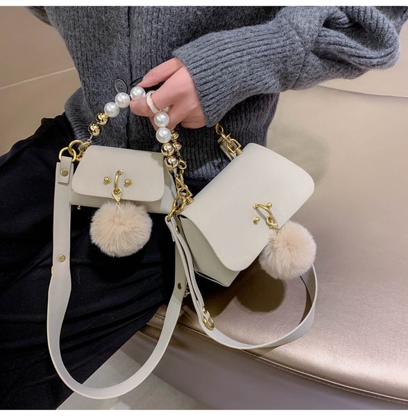 luxury kids pearl handbags designer woman girls pompom metal chain single shoulder bag mother and daughter messenger bags f323, Black
luxury kids pearl handbags designer woman girls pompom metal chain single shoulder bag mother and daughter messenger bags f323, Black