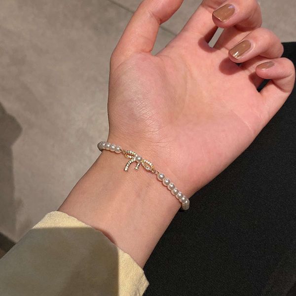 exquisite bow and pearl bracelet, small design feeling, simple girl friend mori's bracelet, Black
exquisite bow and pearl bracelet, small design feeling, simple girl friend mori's bracelet, Black