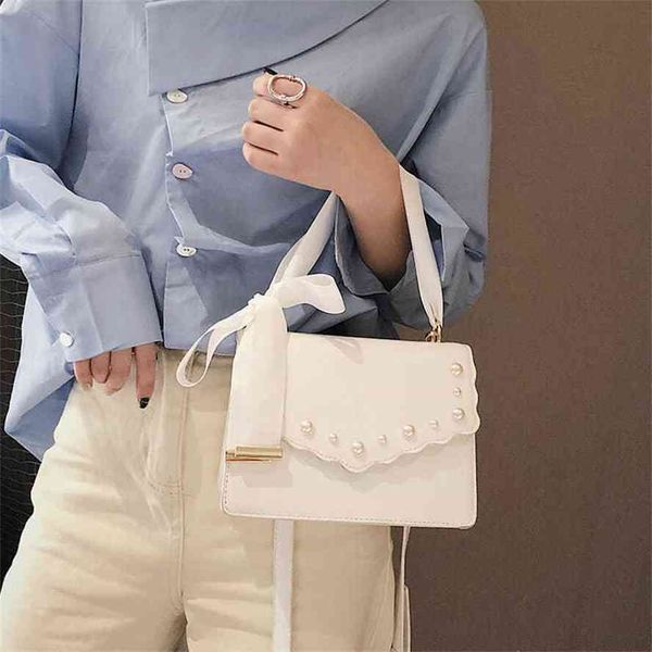 handbag2021 new net red same fairy messenger ribbon bow women's fashion pearl portable shoulder baggg bag
handbag2021 new net red same fairy messenger ribbon bow women's fashion pearl portable shoulder baggg bag