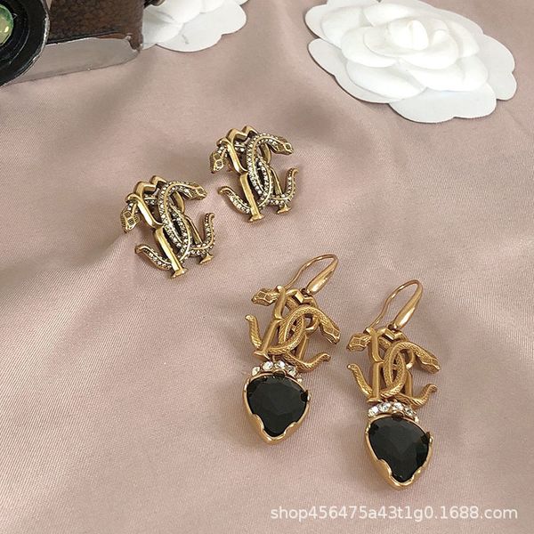 21 new fashion brand old pendant earrings female double snake surround hollow earrings s925, Golden
21 new fashion brand old pendant earrings female double snake surround hollow earrings s925, Golden