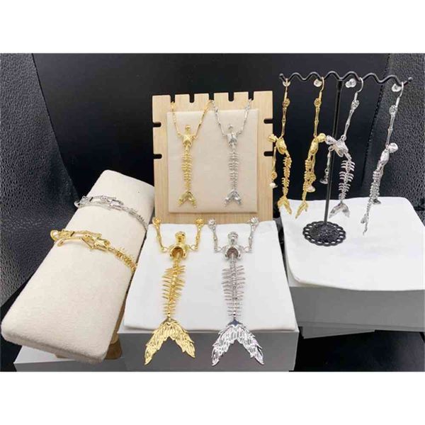 empress dowager punk gold and silver mermaid skeleton earrings necklace bracelet -- b8290
empress dowager punk gold and silver mermaid skeleton earrings necklace bracelet -- b8290