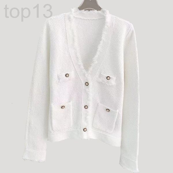 women's sweaters designer spring new mo home carved button v-neck woolen grain sense sweater women's wool plucked tassel fashion, White;black 
women's sweaters designer spring new mo home carved button v-neck woolen grain sense sweater women's wool plucked tassel fashion, White;black