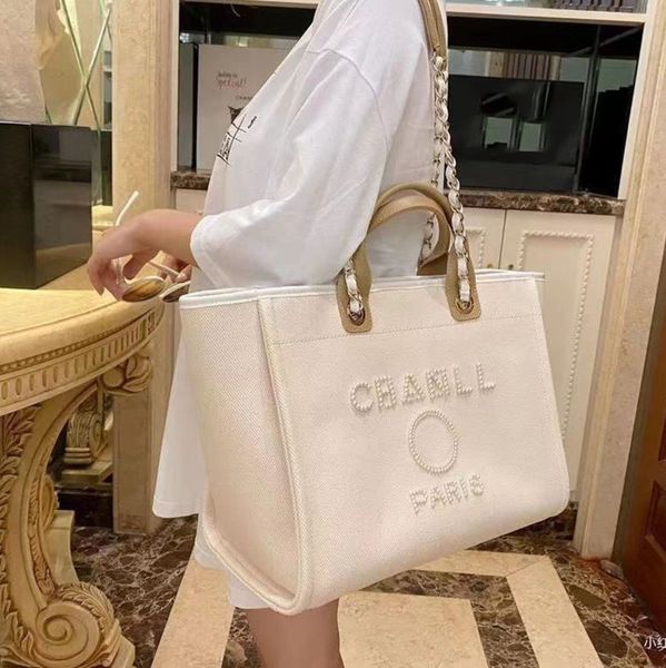 classic luxury designer beach bags canvas pearl evening bag brand portable shopping large capacity handbag women handbags label backpack lad
classic luxury designer beach bags canvas pearl evening bag brand portable shopping large capacity handbag women handbags label backpack lad