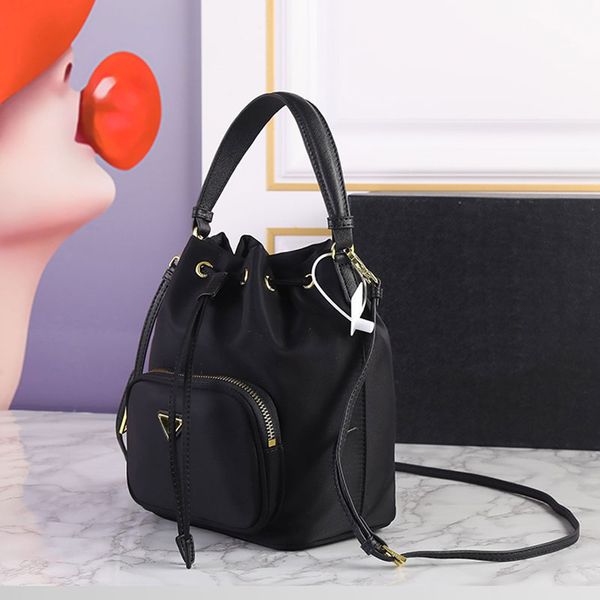 nylon bucket handbag parachute string handle crossbody bags purse genuine leather shoulder bag golden hardware triangle detachable thin stra, White
nylon bucket handbag parachute string handle crossbody bags purse genuine leather shoulder bag golden hardware triangle detachable thin stra, White
