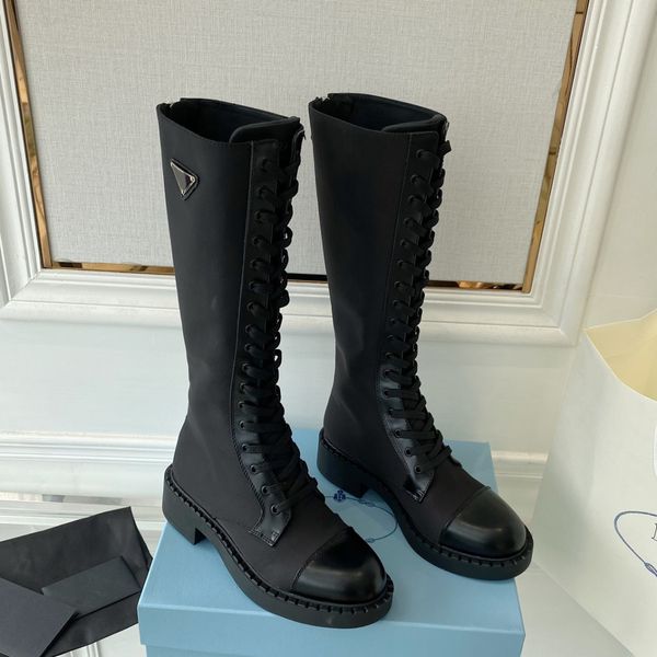 black calf leather trim patchwork nylon tall combat boots knee-high lace-up vamp rounded toe flat side logo triangle plaque luxury designer
black calf leather trim patchwork nylon tall combat boots knee-high lace-up vamp rounded toe flat side logo triangle plaque luxury designer