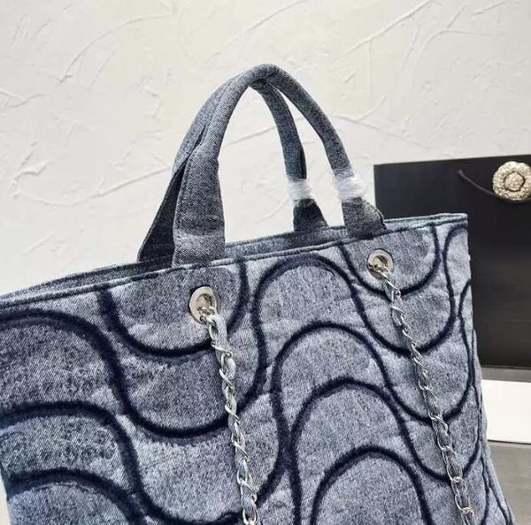 tz women's luxury blue black beach bag wave pattern denim shoulder bags designer silver hardware metal chains high capacity french hand
tz women's luxury blue black beach bag wave pattern denim shoulder bags designer silver hardware metal chains high capacity french hand