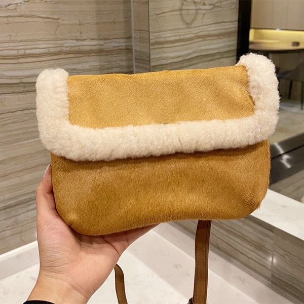 autumn and winter 2022 women's messenger bag lamb fur one simple atmosphere portable high-end luxury pure color immortal bag
autumn and winter 2022 women's messenger bag lamb fur one simple atmosphere portable high-end luxury pure color immortal bag