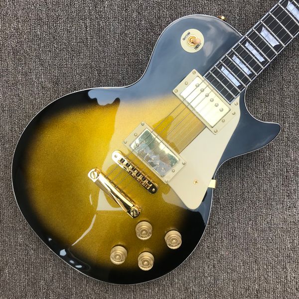 rosewood fingerboard electric guitar, gold with black rim, tune-o-matic bridge, solid mahogany body
rosewood fingerboard electric guitar, gold with black rim, tune-o-matic bridge, solid mahogany body