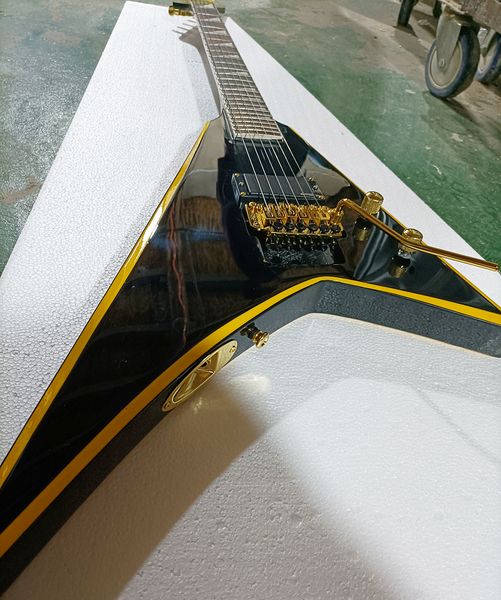 6 strings black v shaped electric guitar with yellow stripe rosewood fretboard
6 strings black v shaped electric guitar with yellow stripe rosewood fretboard
