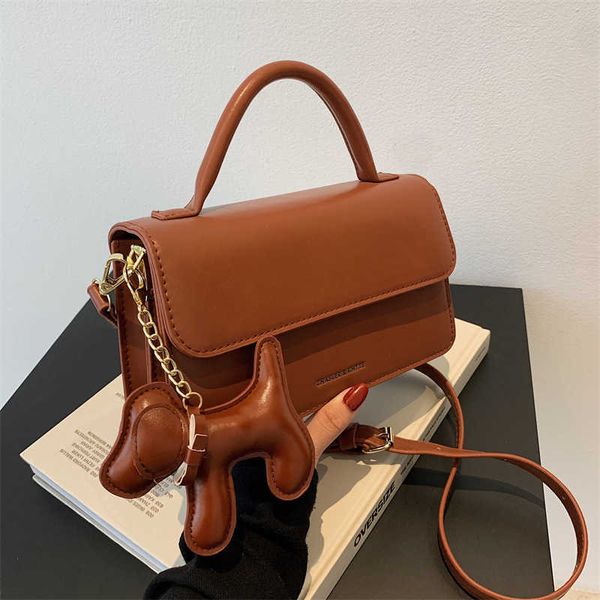showecomfort01 store2022popular bag female new fashion dog pendant handbag versatile simple solid color messenger bag
showecomfort01 store2022popular bag female new fashion dog pendant handbag versatile simple solid color messenger bag