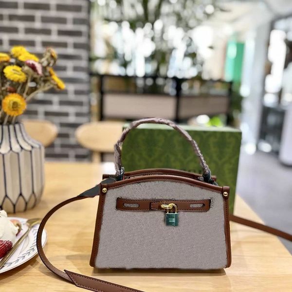 women shoulder bag vintage canvas printed letters with leather trim simple advanced multifunctional buckle handbag
women shoulder bag vintage canvas printed letters with leather trim simple advanced multifunctional buckle handbag