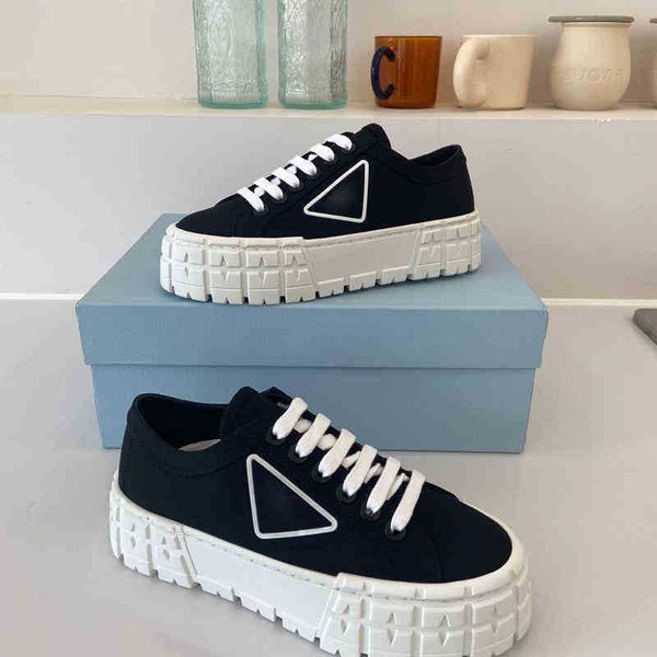 8 color rubber platform inspired by motocross tires defines the unusual design of these nylon gabardine sneakers. the triangle decorate, Black
8 color rubber platform inspired by motocross tires defines the unusual design of these nylon gabardine sneakers. the triangle decorate, Black