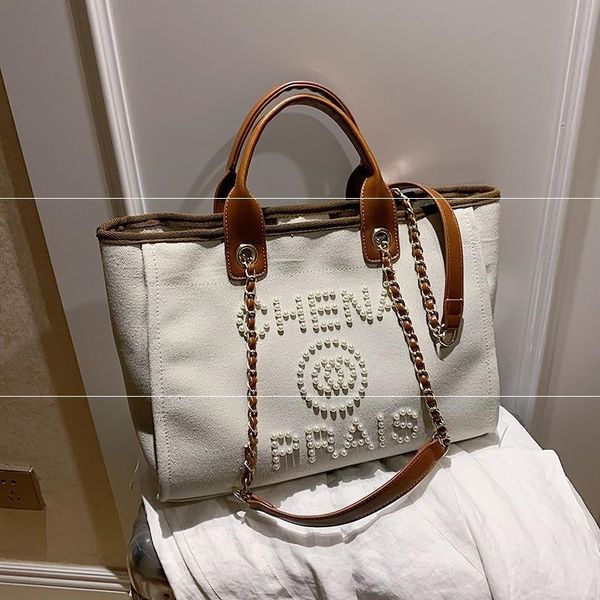 women's fashion designer's new luxury canvas luxury messenger large volume one shoulder tote bags handbags women g220601
women's fashion designer's new luxury canvas luxury messenger large volume one shoulder tote bags handbags women g220601