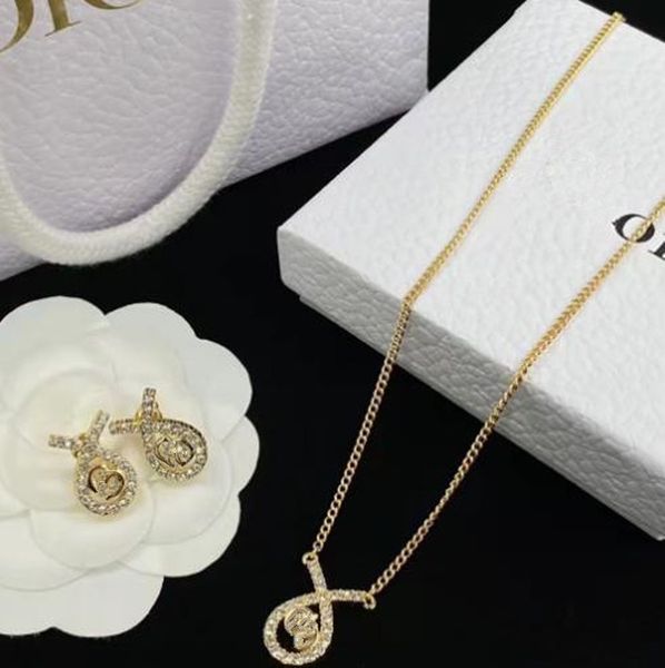 new inlay rhinestone pendant necklace round crossed letter necklace choker stud earrings, Silver
new inlay rhinestone pendant necklace round crossed letter necklace choker stud earrings, Silver