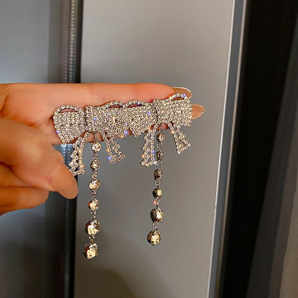 925 silver needle vintage court style design full diamond bow tassel earrings internet celebrity simple stud earrings long eardrop, Golden
925 silver needle vintage court style design full diamond bow tassel earrings internet celebrity simple stud earrings long eardrop, Golden