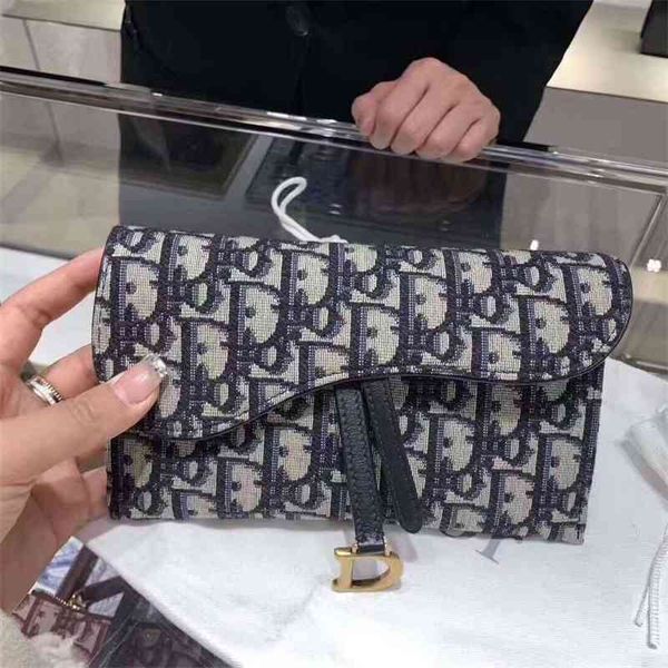 di0p women's designer women oblique printed saddle woc chain flip one shoulder messenger bag
di0p women's designer women oblique printed saddle woc chain flip one shoulder messenger bag