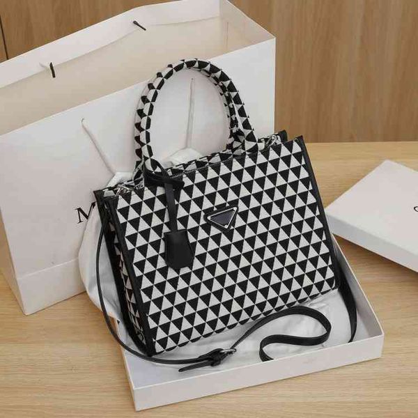 2022 new family embroidered tote bag canvas triangle tote zither score bag hand-held sling one shoulder messenger bag
2022 new family embroidered tote bag canvas triangle tote zither score bag hand-held sling one shoulder messenger bag