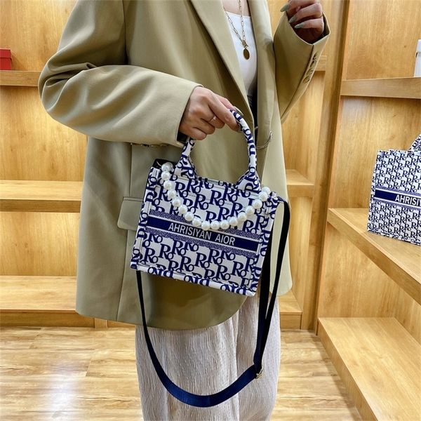 canvas large capacity new fashion portable women's foreign style ins one tote design purses online 
canvas large capacity new fashion portable women's foreign style ins one tote design purses online