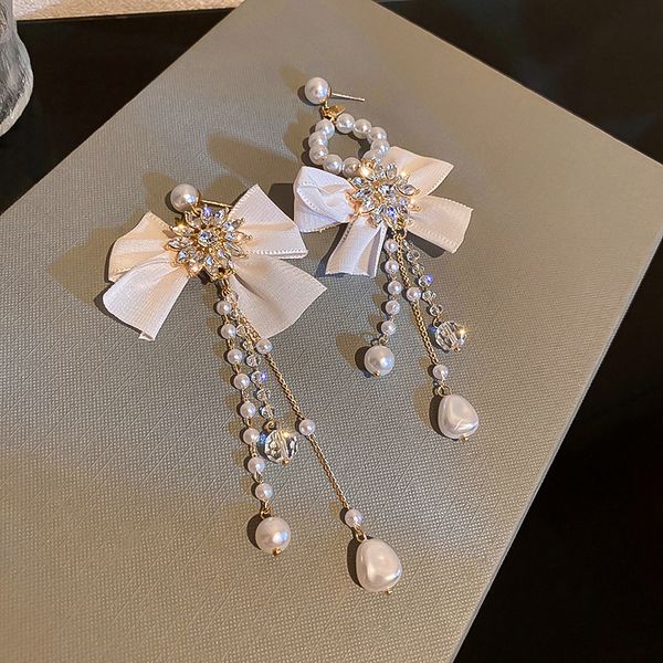 european and american pearl crystal bow tassel asymmetric dangle earrings gentle light luxury exaggerated jewelry for women, Silver
european and american pearl crystal bow tassel asymmetric dangle earrings gentle light luxury exaggerated jewelry for women, Silver