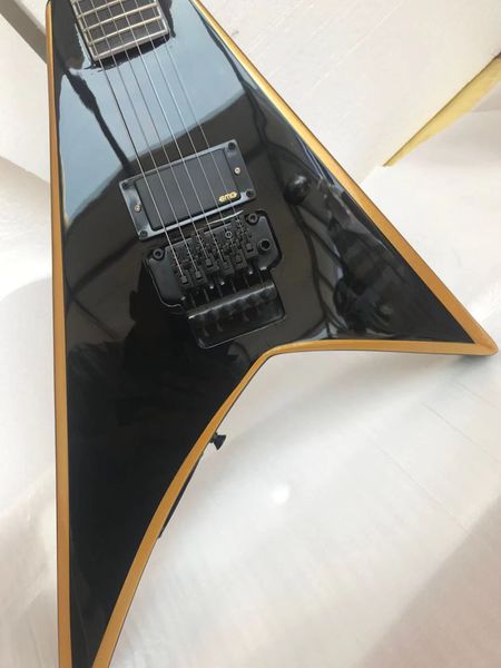 custom 6-string v-shaped electric guitar black body with gold binding tremolo bridge delivery
custom 6-string v-shaped electric guitar black body with gold binding tremolo bridge delivery