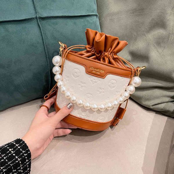 2022 factory wholesale new small bag female summer fashion autumn winter textured embossed pearl portable messenger bucket bag
2022 factory wholesale new small bag female summer fashion autumn winter textured embossed pearl portable messenger bucket bag