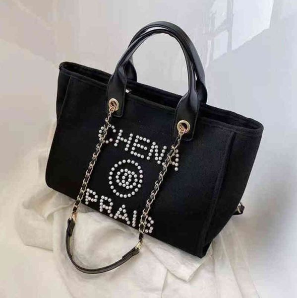 luxury classic fashion beach bags tote label pearl evening bag portable large capacity female designer canvas handbag brand women handbags l
luxury classic fashion beach bags tote label pearl evening bag portable large capacity female designer canvas handbag brand women handbags l