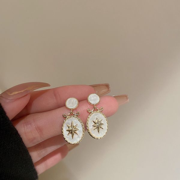 real gold electroplated korean dongdaemun silver needle eight awn star oval earrings retro temperamental earrings eardrop for women, Golden
real gold electroplated korean dongdaemun silver needle eight awn star oval earrings retro temperamental earrings eardrop for women, Golden