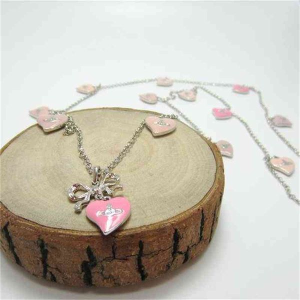 west empress dowager silver bow hanging pink peach heart multi heart saturn necklace -- b8103
west empress dowager silver bow hanging pink peach heart multi heart saturn necklace -- b8103