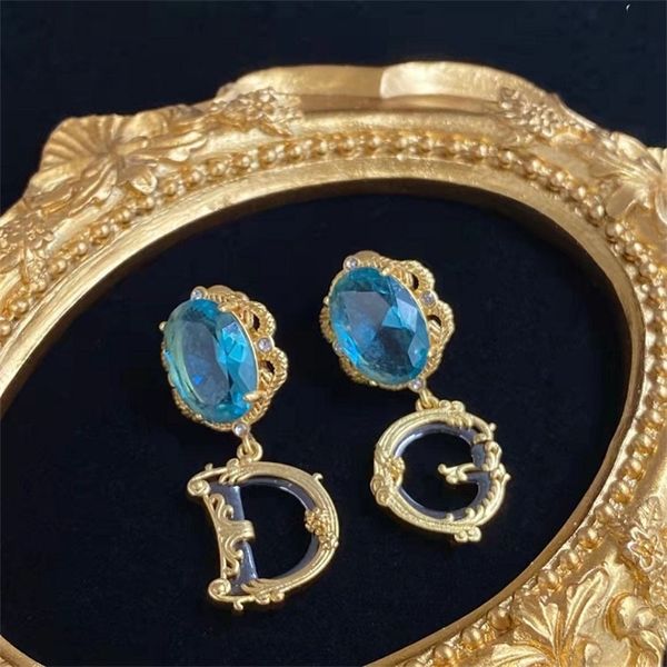 letter inlaid with large blue rhinestone cool wind brass 925 silver needle female ornament, Golden 
letter inlaid with large blue rhinestone cool wind brass 925 silver needle female ornament, Golden