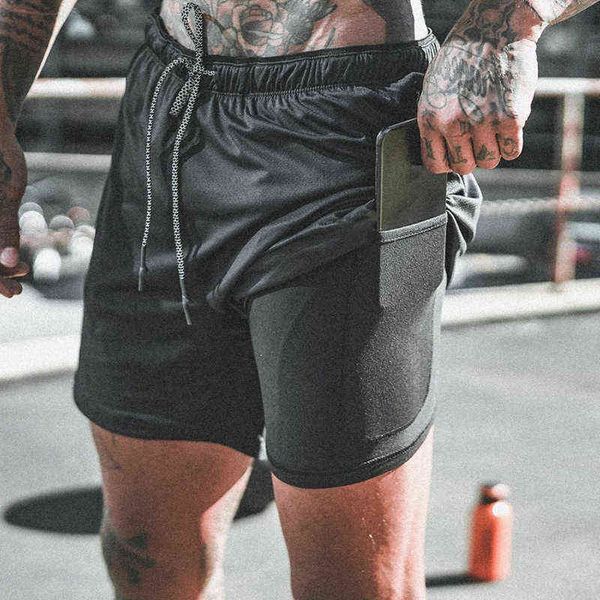 men's sports shorts 2 in 1 double layer jogging breathable shorts men's gym training mesh five-point pants t220517, White;black
men's sports shorts 2 in 1 double layer jogging breathable shorts men's gym training mesh five-point pants t220517, White;black