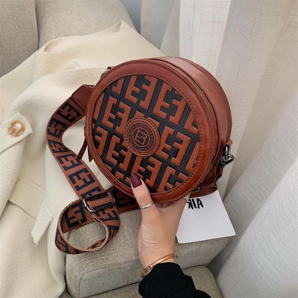 new fashion small round circle bag new wide shoulder strap cross carrying one leisure women's backpack indentation letter2314
new fashion small round circle bag new wide shoulder strap cross carrying one leisure women's backpack indentation letter2314
