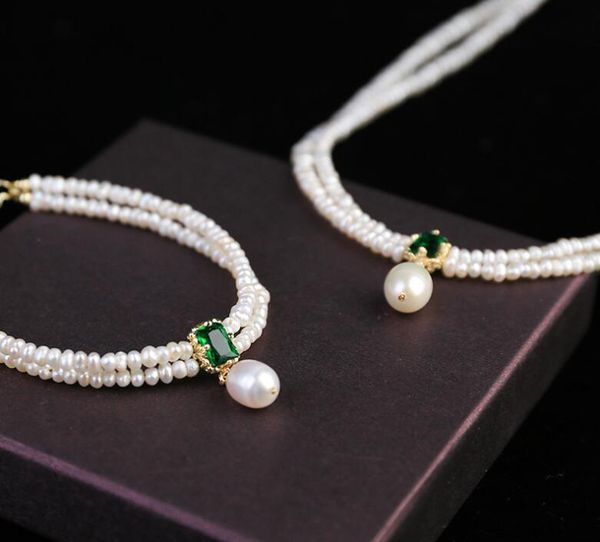 18k gold plated emerald double-layer freshwater pearl necklace small rice beads, Silver
18k gold plated emerald double-layer freshwater pearl necklace small rice beads, Silver